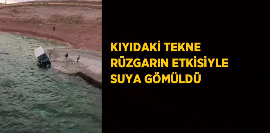 KIYIDAKİ TEKNE RÜZGARIN ETKİSİYLE SUYA GÖMÜLDÜ